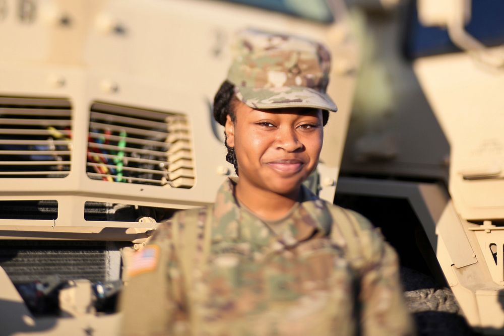 New Jersey Army National Guard Private 1st Class Tajanay Blackwell from the 253rd Transportation Company stands for a…