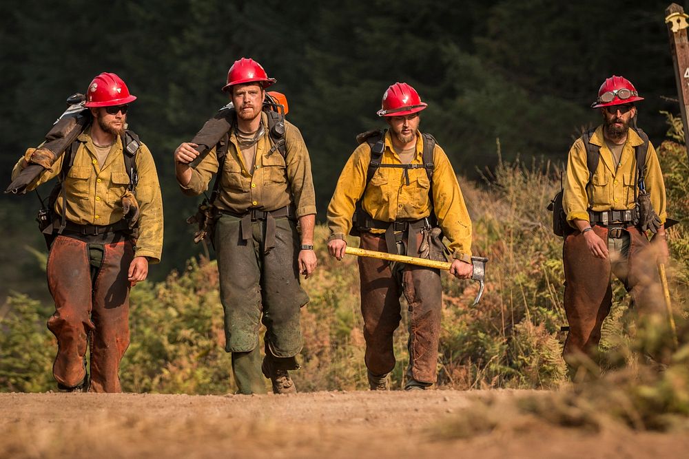 Firefighters with the Devil's Canyon Hand Crew, calls it a day after supervising tactical training with the Soldiers…