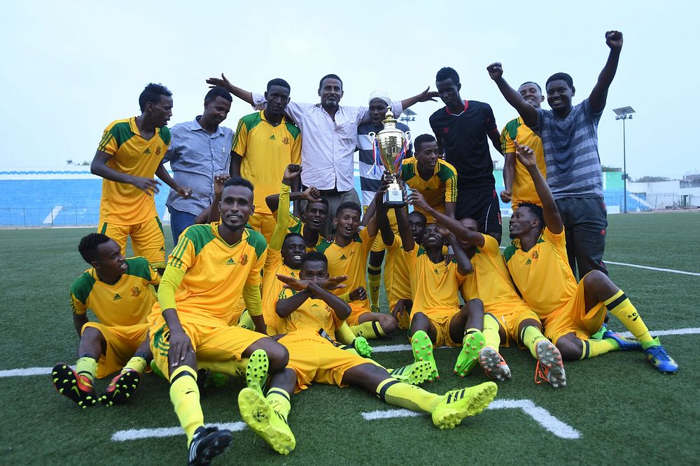 Players from Banadir Football Club celebrate their victory over Gaadiidka Football Club in a match organized to mark the…