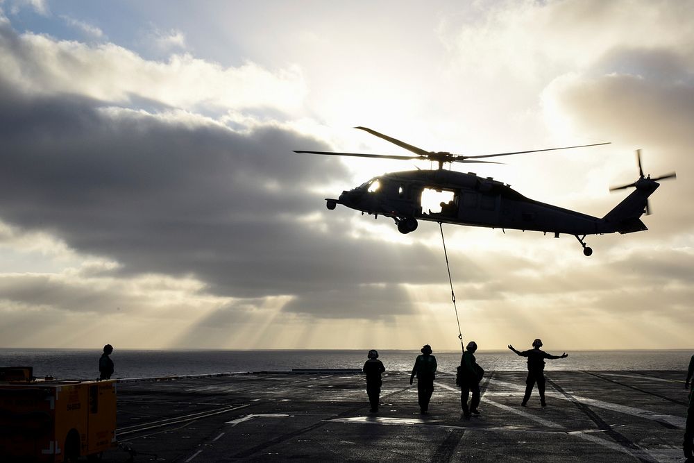 A U.S. Navy MH-60S Sea Hawk helicopter assigned to Helicopter Sea Combat Squadron (HSC) 6 transports cargo during a…