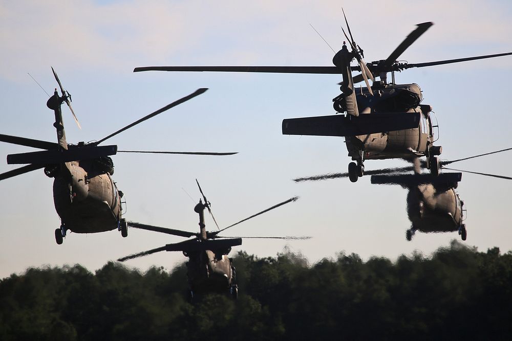 U.S. Army UH-60 Black Hawks from the New Jersey National Guard's 1-150 Assault Helicopter Battalion take off in a multi-ship…