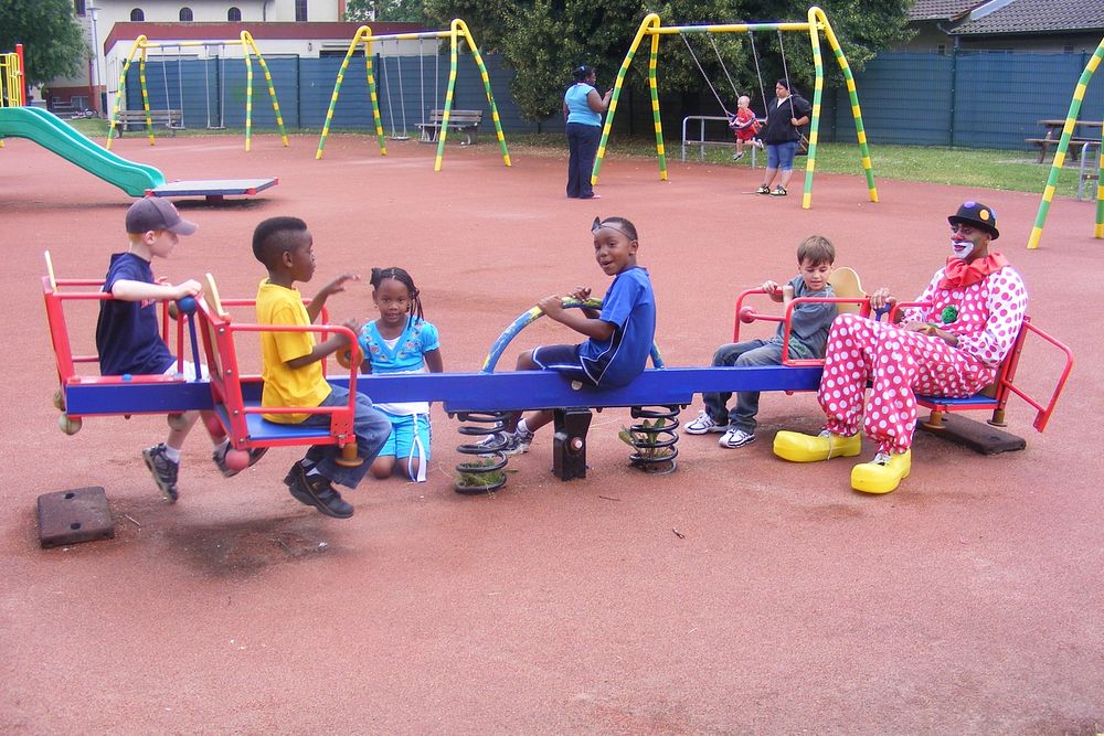Clowning AroundKlutz the Clown, or Staff Sgt. Myron Jamerson, plays on a seesaw at the Patrick Henry Village playground…