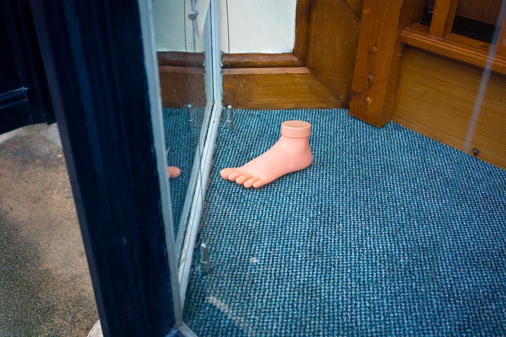 Foot in front of a mirror. Original public domain image from Flickr