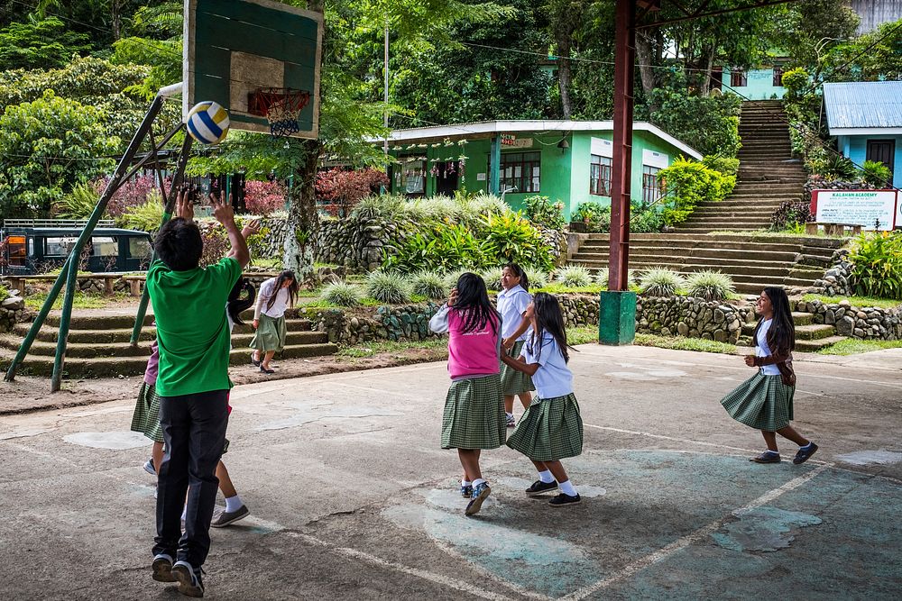 Asian students playing volleyball, Imugan, Nueva Vizcaya, Philippines, July 2017.