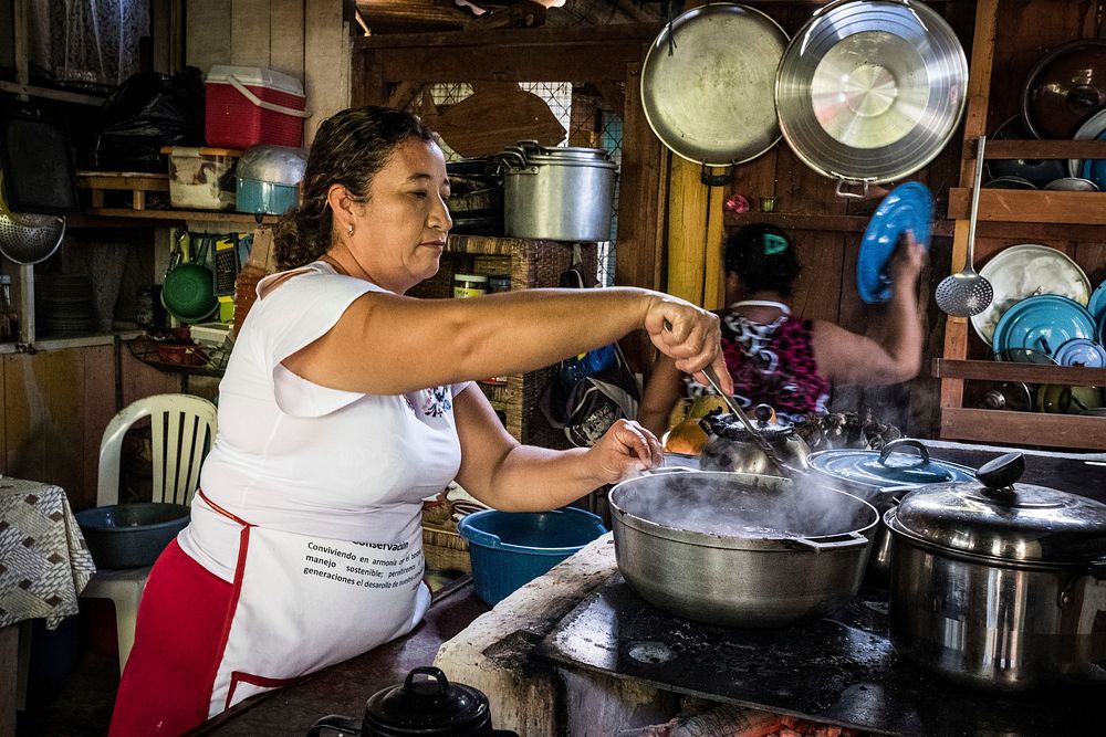 Woman cooking in local kitchen, Uaxactun, Guatemala, November 2017.