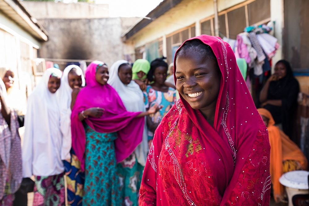 A young girl pictured with her friends, Nigeria. For 17-year-old Aisha Mohammed, education is playing a vital role in…