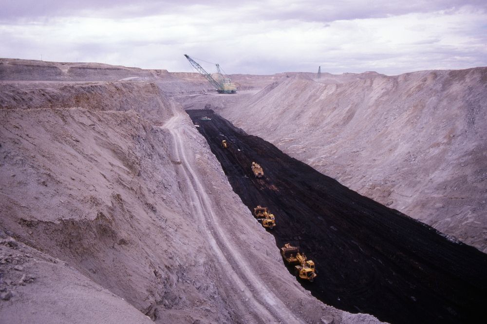 Heavy equipment working in excavated area at Decker Coal Company, October 1979. Original public domain image from Flickr