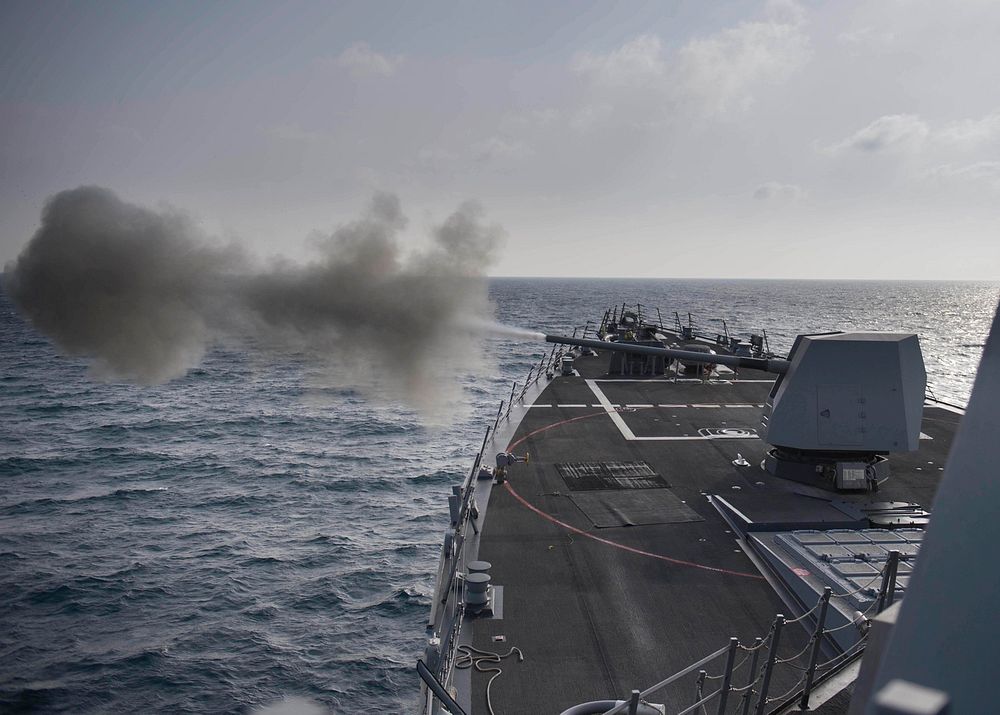 The U.S. Navy guided-missile destroyer USS Preble (DDG 88) fires a Mark 45 5-inch gun during a live-fire exercise in the…