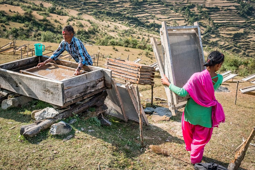 Girl drying handmade paper in remote mountain, Kailash, Bajhang District, Nepal, October 2017.