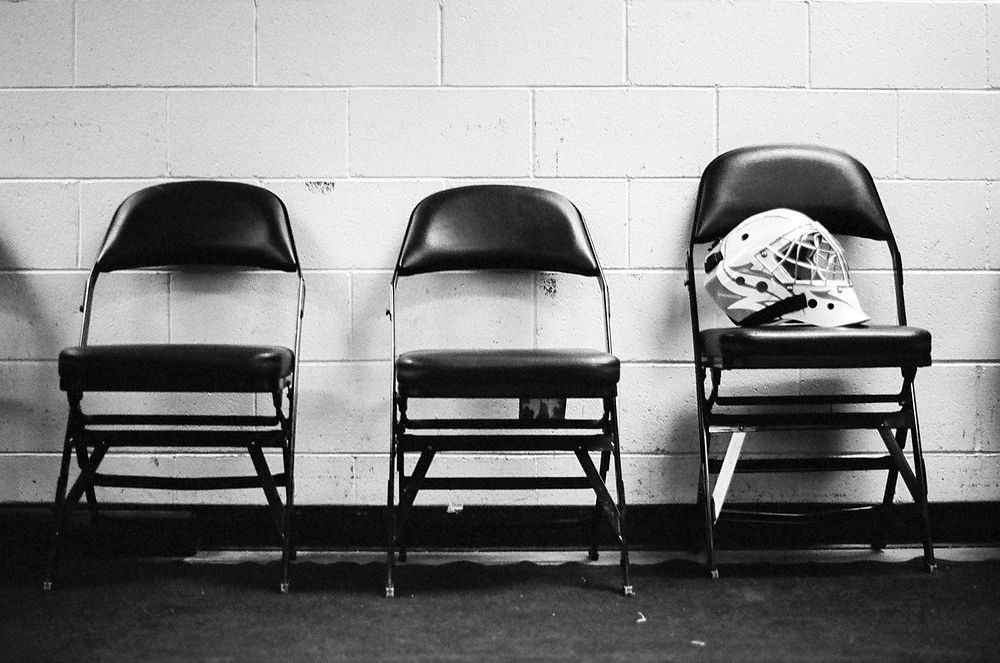 A soldier&rsquo;s helmet rests on a chair outside a locker room during the 5th Annual Army vs. Air Force Hockey Game, Jan.…