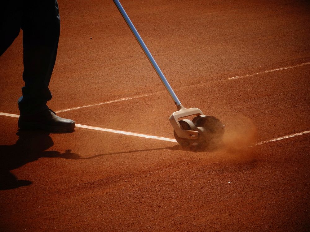 Maintenance on tennis court, background photo. Free public domain CC0 image.