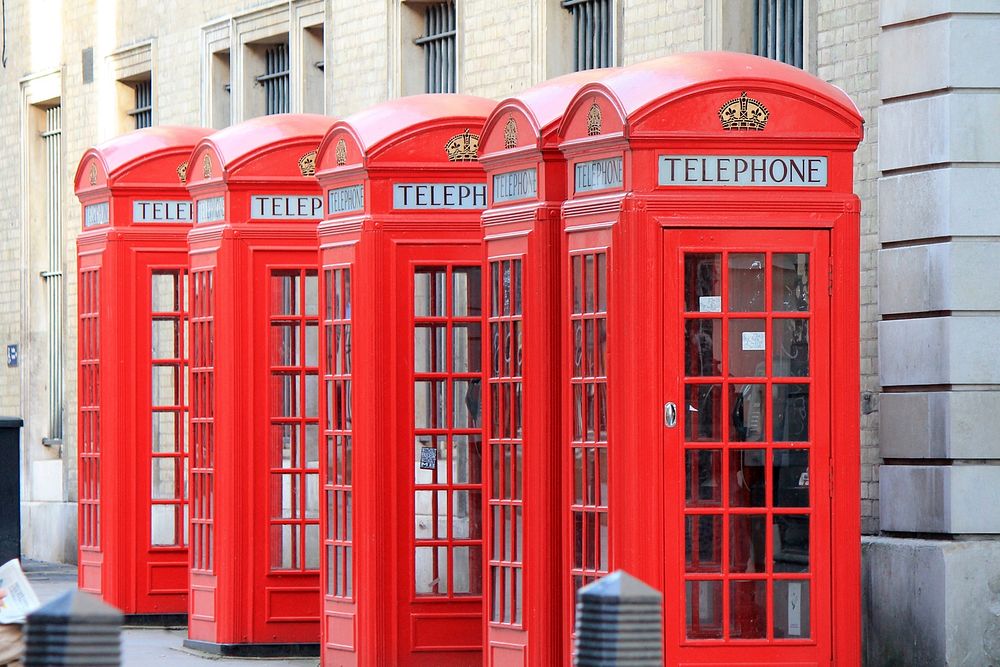 Iconic red phone booth in London, England. Free public domain CC0 photo.