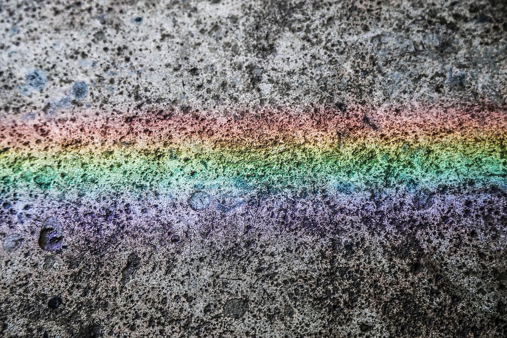 Rainbow on black rough background. Free public domain CC0 photo.