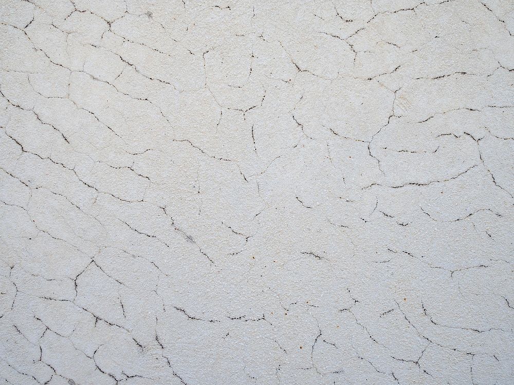 Grunge cracked white wall texture. Free public domain CC0 photo.