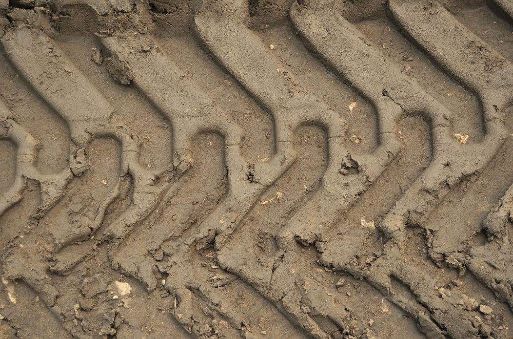 Tire track on the ground. Free public domain CC0 photo
