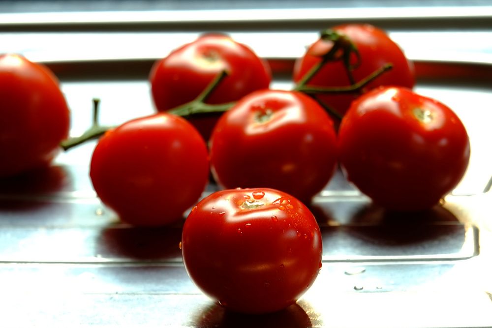 Closeup on cherry tomatoes on table. Free public domain CC0 image.