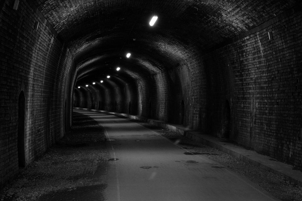 Dark tunnel. Free public domain CC0 photo.