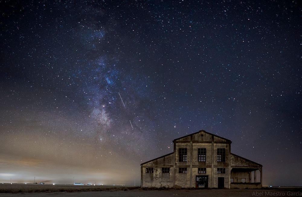 House under starry night sky. Free public domain CC0 photo.