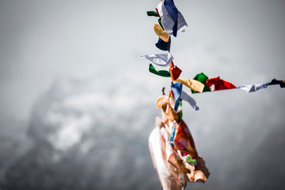 Free religious flags hanging on mountain image, public domain CC0 photo.