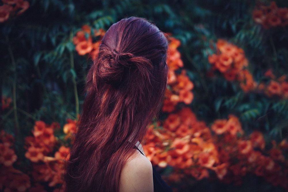 Girl red color long hair with flower background, free public domain CC0 photo.