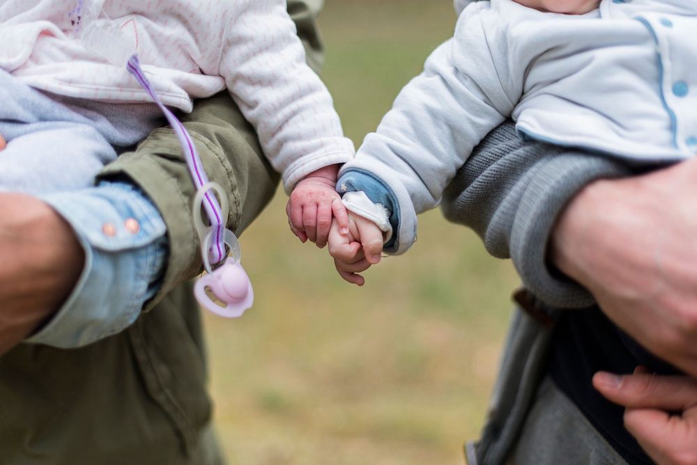 Free two babies holding hands image, public domain people CC0 photo.