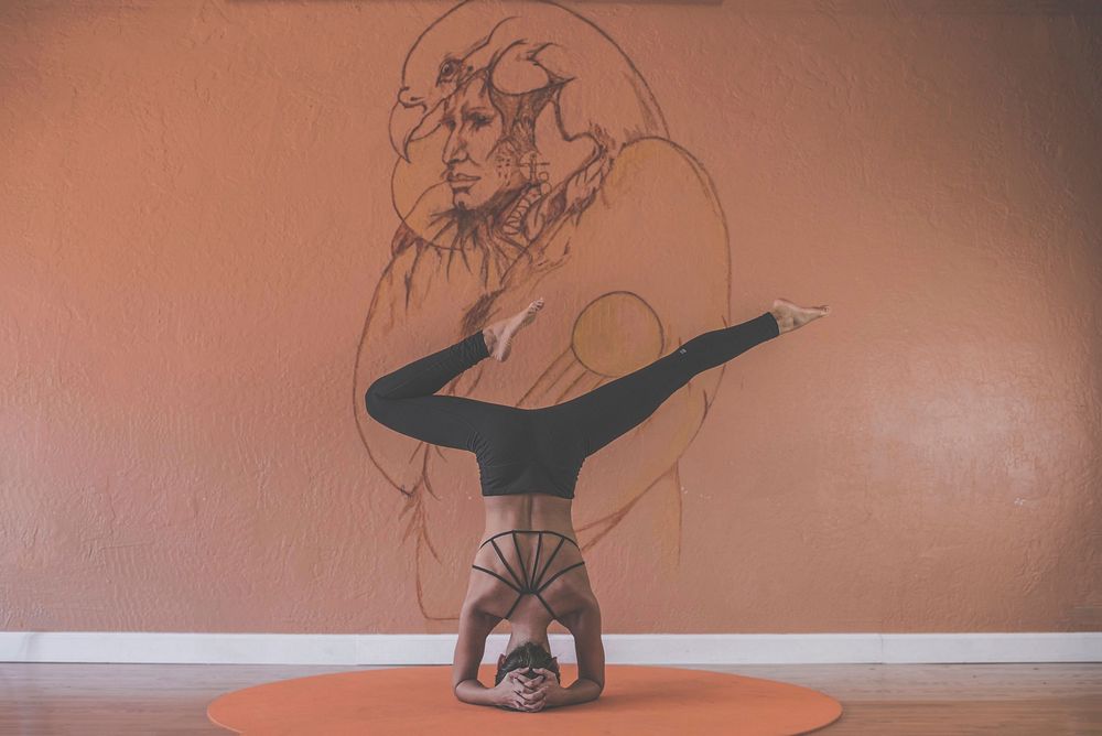 Free woman doing a yoga pose photo, public domain CC0 image.