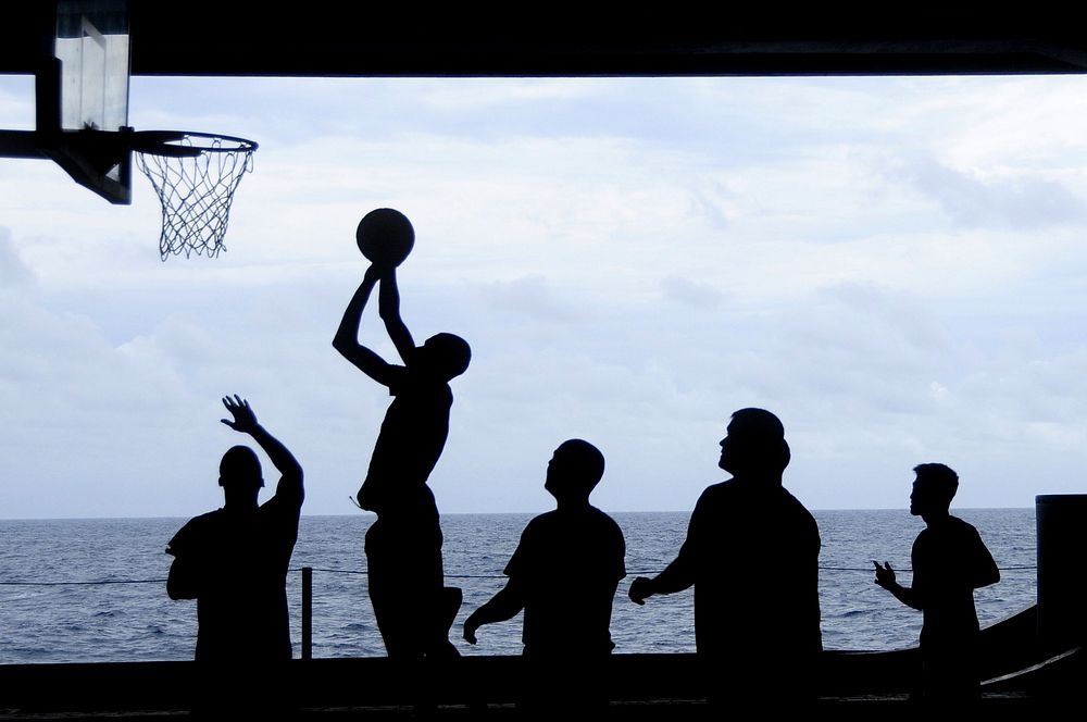 Basketball by the ocean, sports photography. Free public domain CC0 image.
