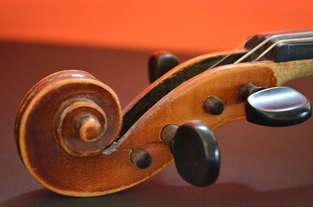 Violin head, musical instrument background. Free public domain CC0 photo.