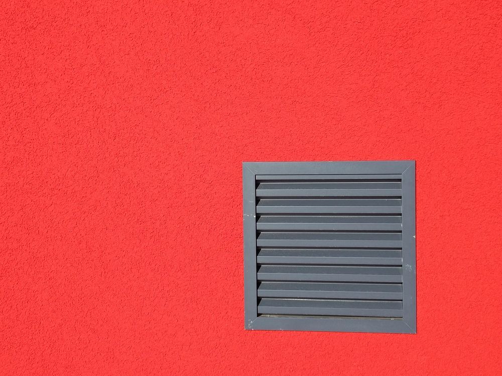 Red wall with ventilation. Free public domain CC0 photo.