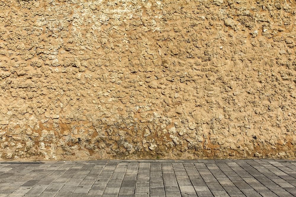 Stone pavement and stone wall. Free public domain CC0 photo.