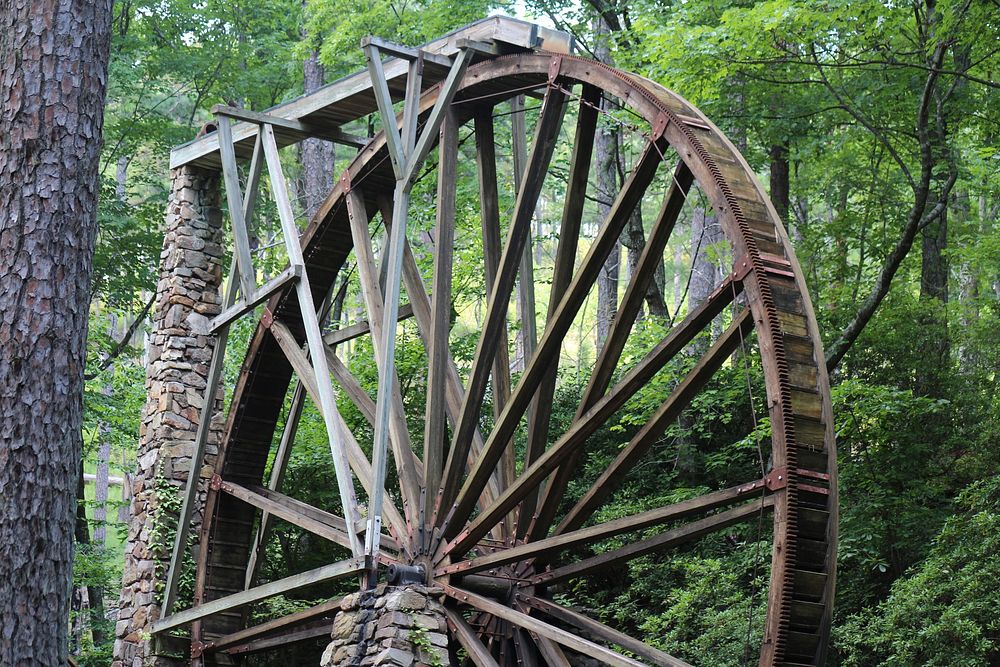 Alloy wheel, wooden machine. Free public domain CC0 image.