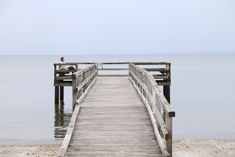 Wooden dock on beach. Free public domain CC0 image.
