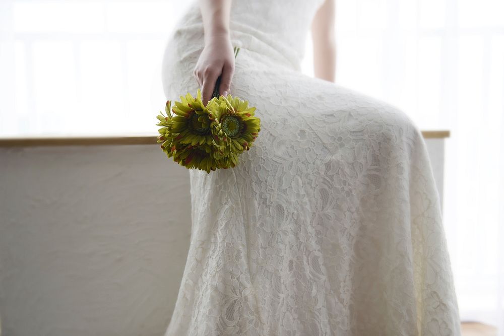 Bride and flower bouquet. Free public domain CC0 image.