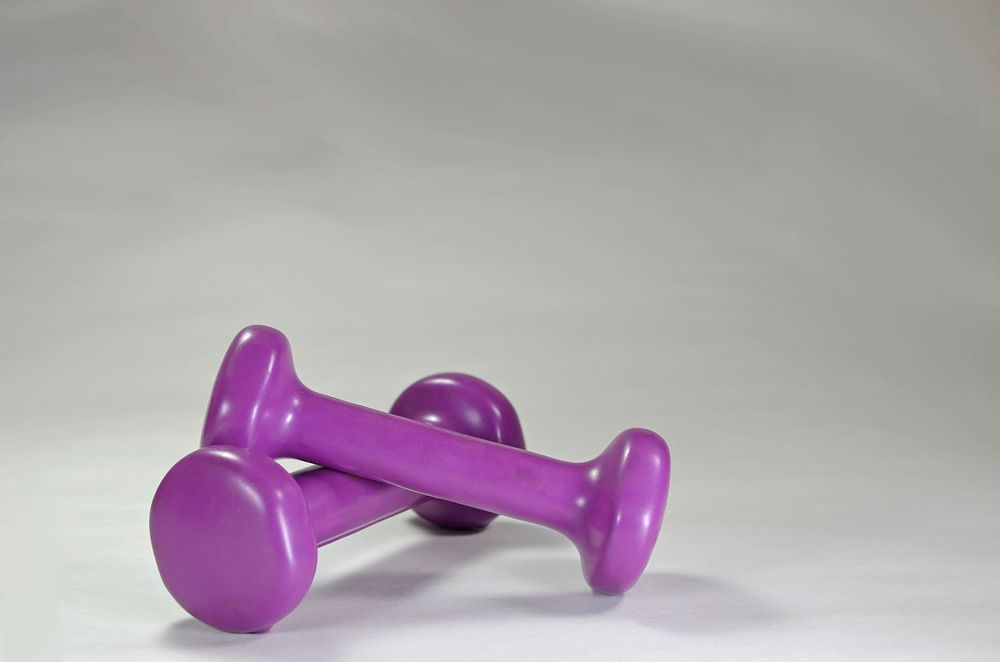 Closeup on purple gym dumbbell. Free public domain CC0 image.