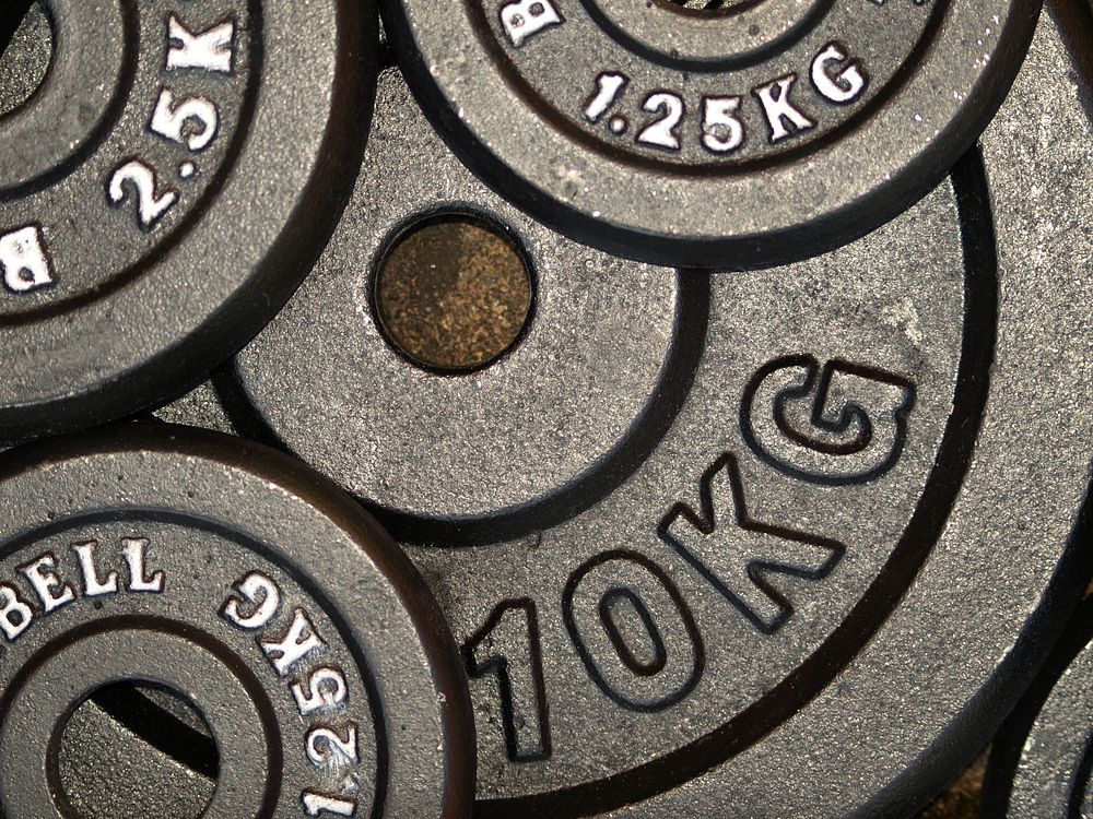 Closeup on gym weight plates. Free public domain CC0 image.