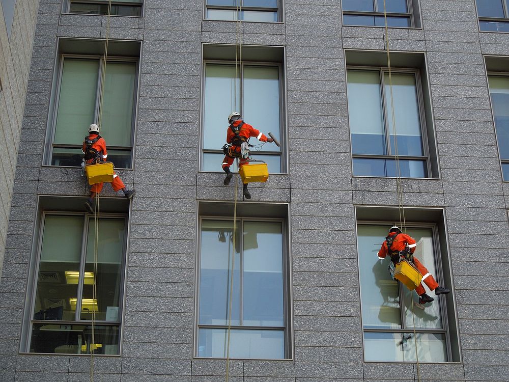 Window cleaners on building. Free public domain CC0 photo.