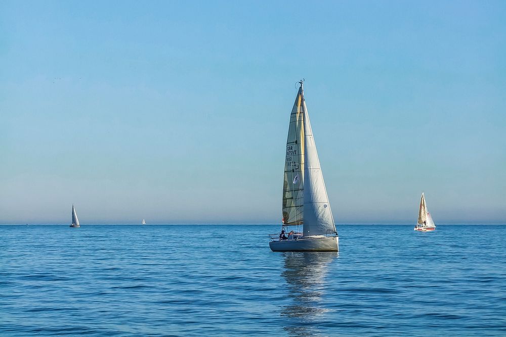 Yacht sailing in the sea. Free public domain CC0 photo.