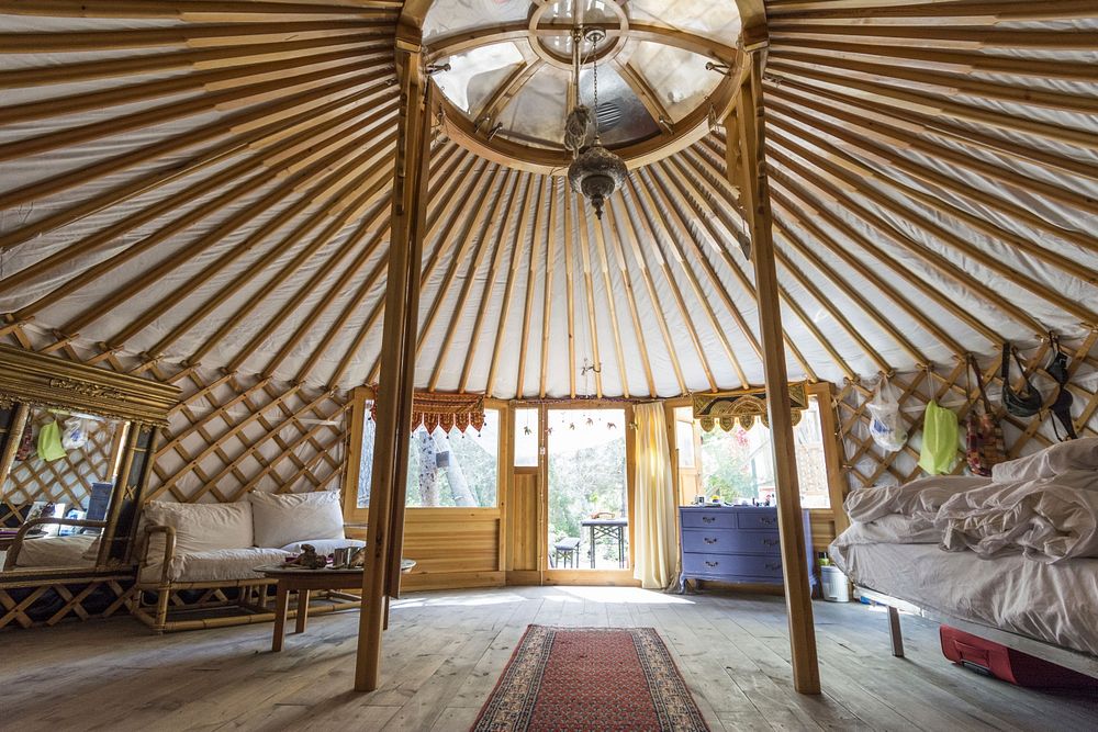 Inside wooden yurt. Free public domain CC0 photo.