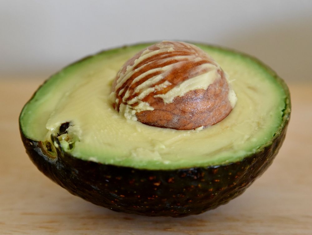 Closeup on avocado cut in half. Free public domain CC0 image.