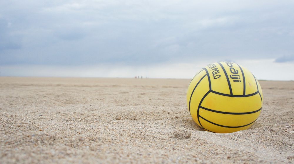 Closeup on volleyball in sand. Free public domain CC0 photo.