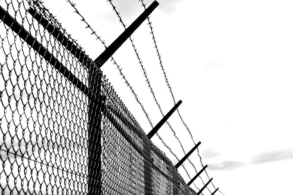 Barbed wire fence, security protection. Free public domain CC0 image