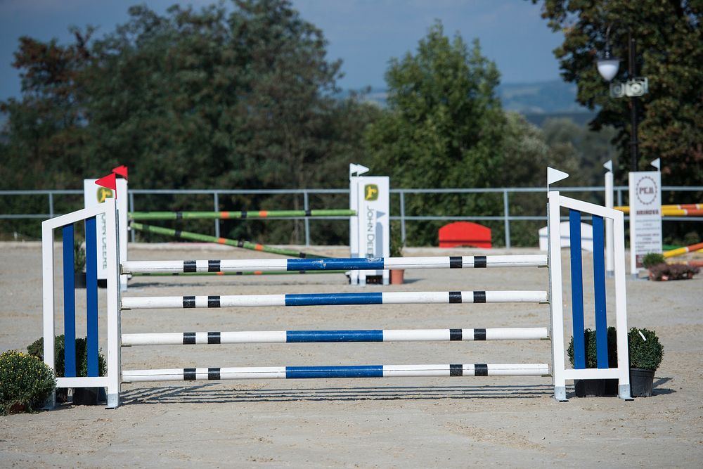 Showjumping fence in arena. Free public domain CC0 photo.
