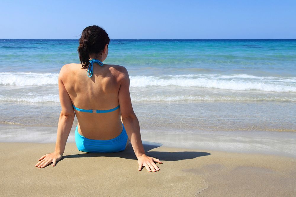 Woman at beach. Free public domain CC0 photo.