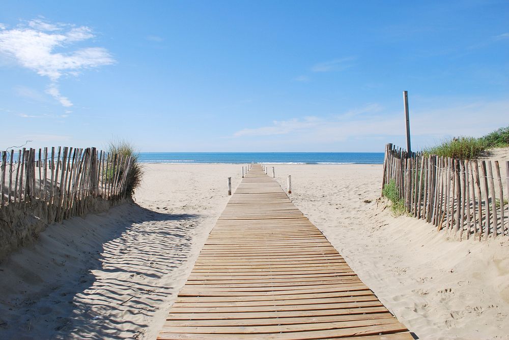 Boardwalk at seaside. Free public domain CC0 image.