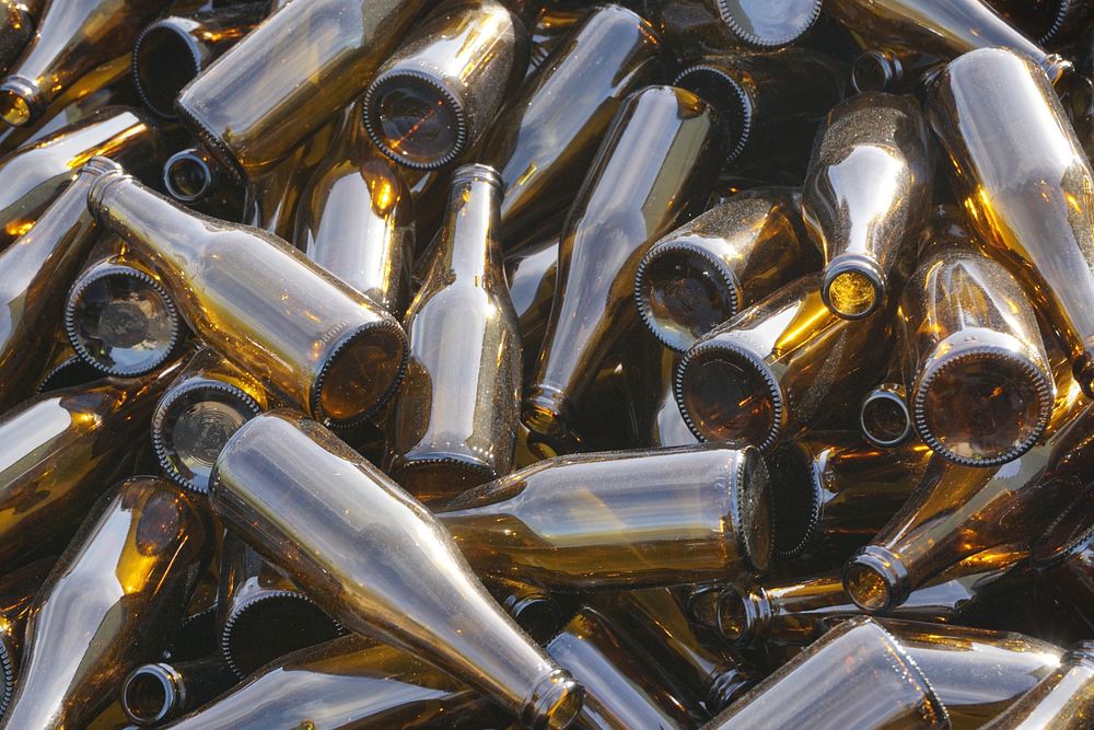 Piles of empty glass beer bottles. Free public domain CC0 photo