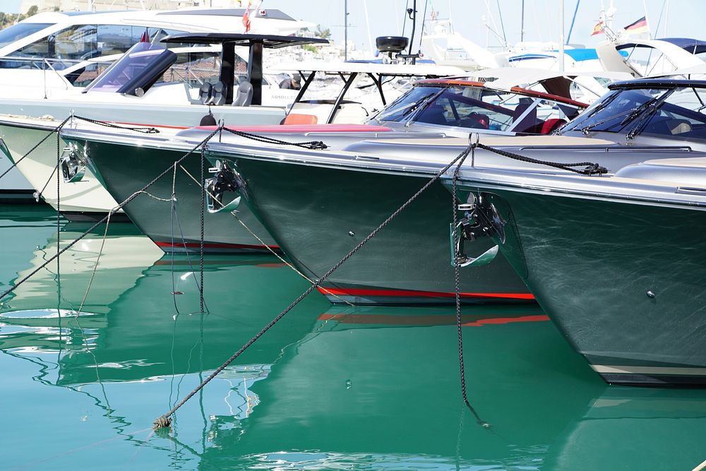 Yachts docking at marina. Free public domain CC0 photo.