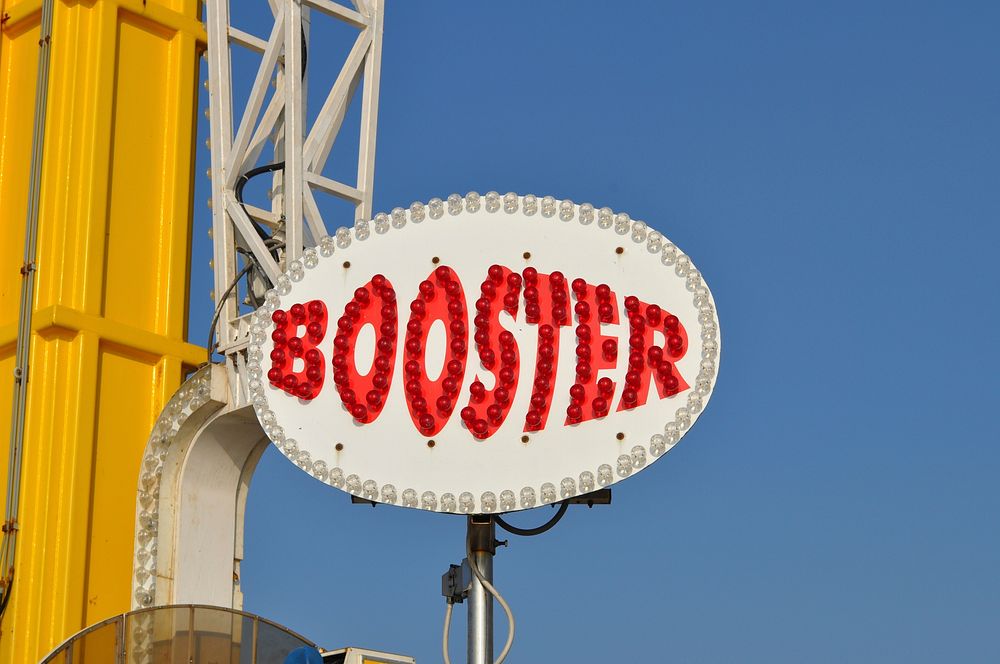 Booster sign, amusement park. Free public domain CC0 image.