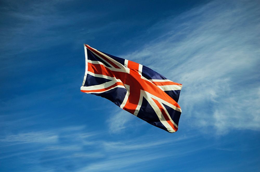 UK flag in blue sky. Free public domain CC0 photo.