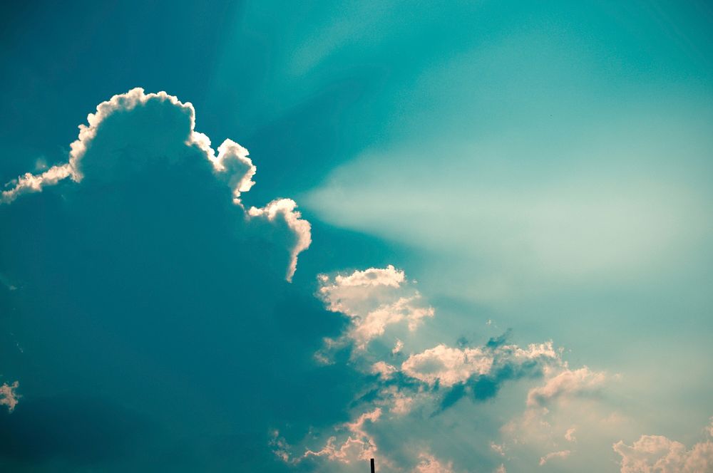 Cloudy sky background, sunbeam. Free public domain CC0 image.