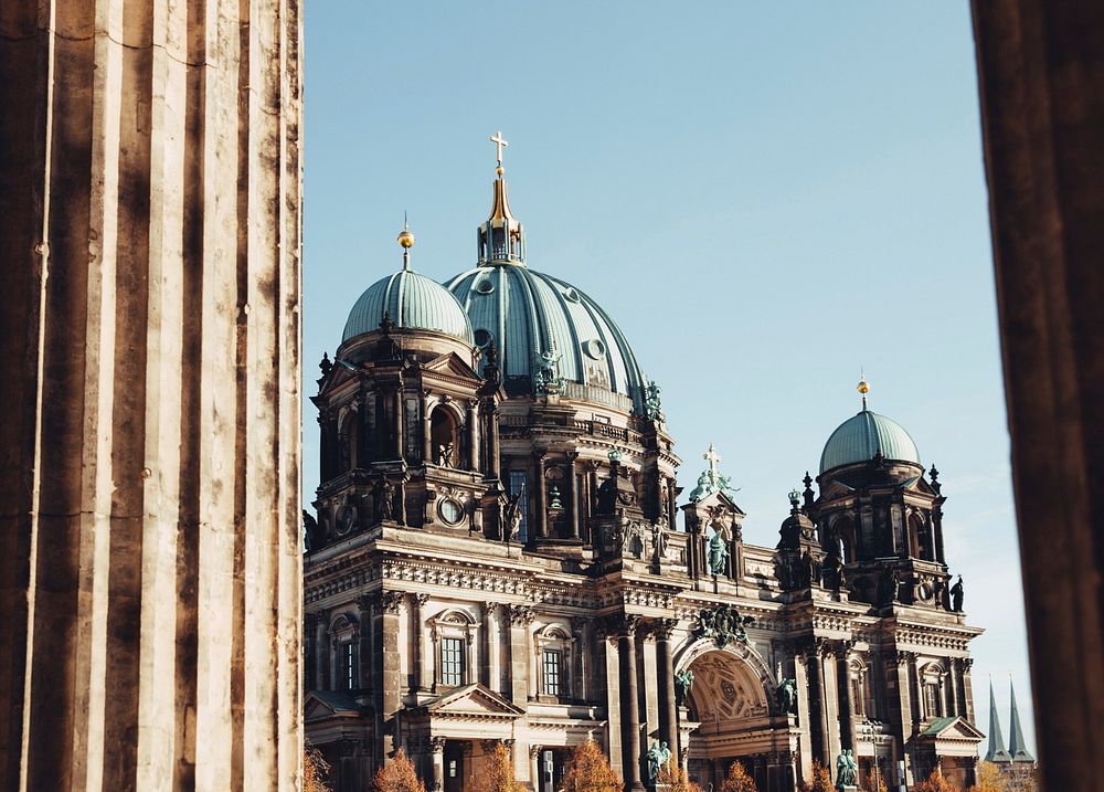 Berlin cathedral through columns at sunset